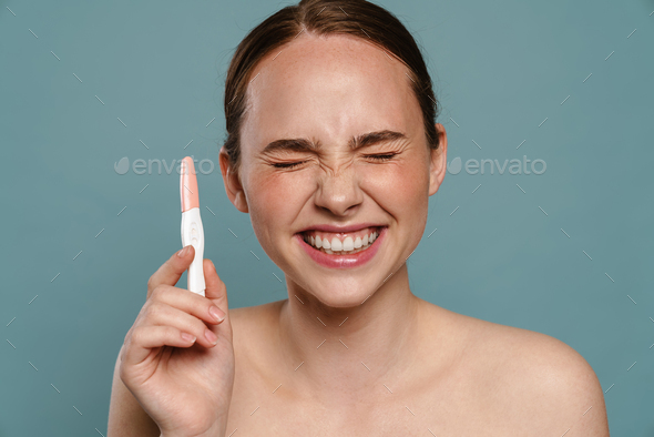 Half Naked Ginger Woman Smiling And Showing Pregnancy Test Stock Photo